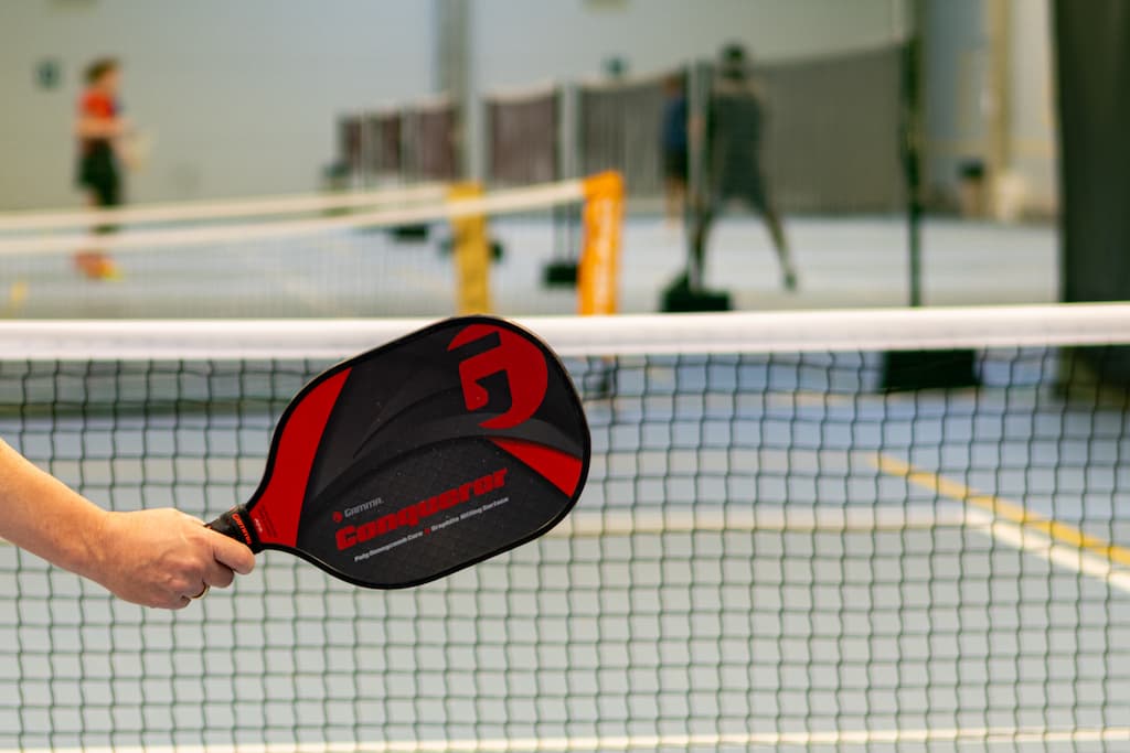 Man holding Padel racket on the court