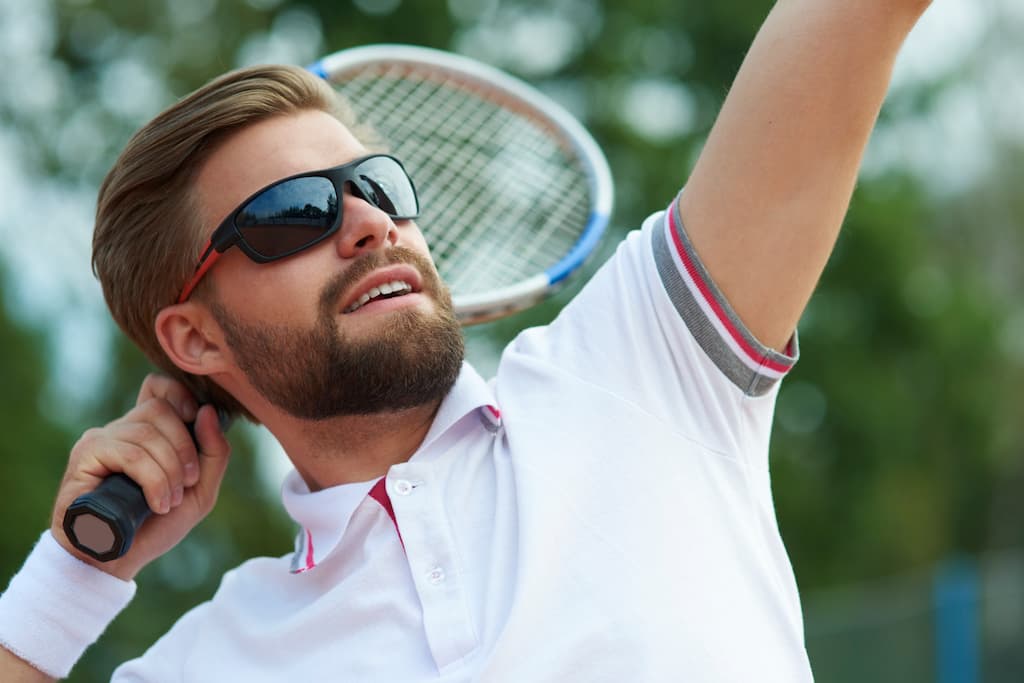 Man wearing eyewear while playing Tennis
