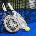 Padel rackets on the Padel court leaned to the net