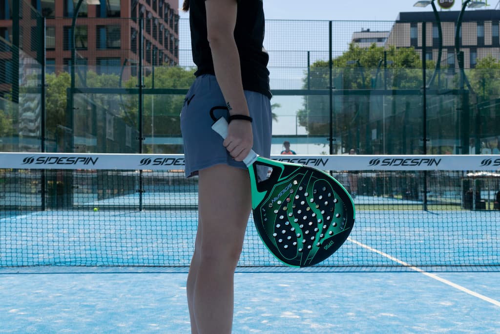 Woman holdin Padel racket on the court